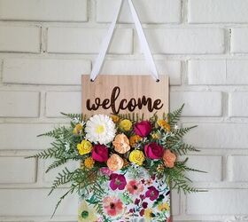 25 spring porch ideas that ll brighten up your block, Floral pocket welcome wall hanging