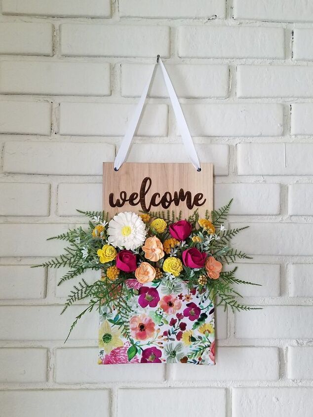 25 spring porch ideas that ll brighten up your block, Floral pocket welcome wall hanging