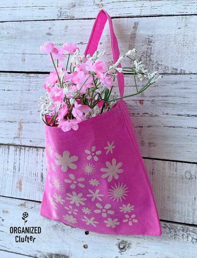 25 spring porch ideas that ll brighten up your block, Stenciled spring decor tote with faux florals