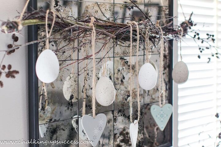 s 15 stunning ways to spruce up your mantel this month, Put up willow branch hanging decor