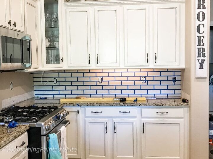 informative diy faux brick tutorial to turn your boring wall into a go