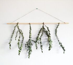 s 20 creative ways to give your home a boho vibe, Tie eucalyptus branches to a dowel for a natural wall hanging