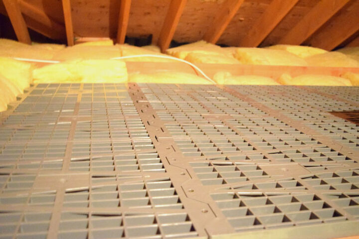 s 25 extremely clever ways to get extra storage space, Put down plastic flooring in your attic for more storage space