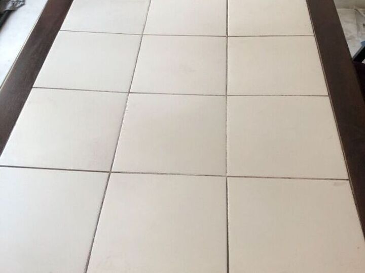 q is this warping tile tabletop fixable