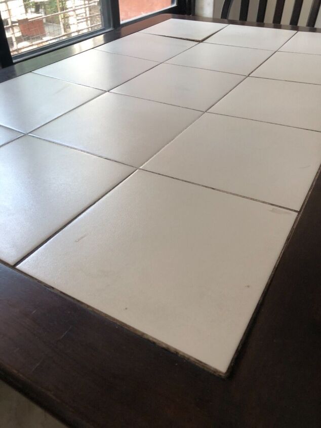q is this warping tile tabletop fixable