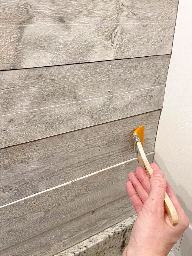 installing rustix wood wall boards to our master bathroom