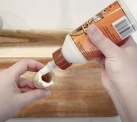 Glue candlesticks to a cutting board to copy this beautiful accent for your countertop