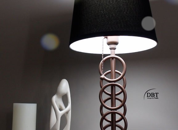 s 25 decor ideas that ll make your living room look magazine worthy, This classy bronze ringed lamp