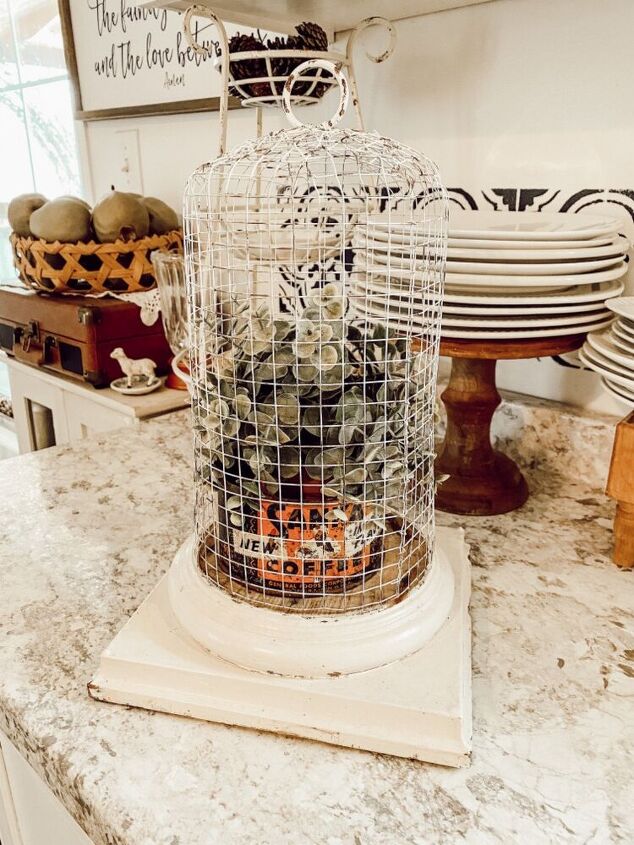 s 25 decor ideas that ll make your living room look magazine worthy, A rustic fenced cloche