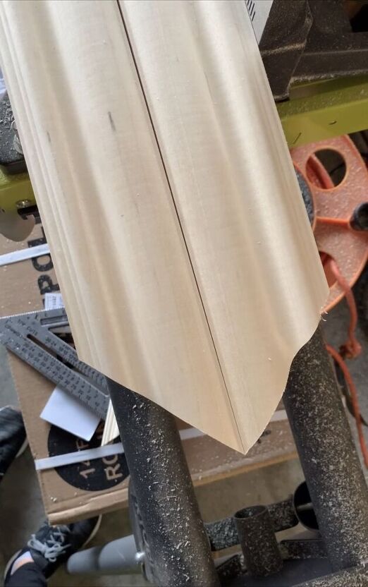 Measuring and cutting two angled edges of molding