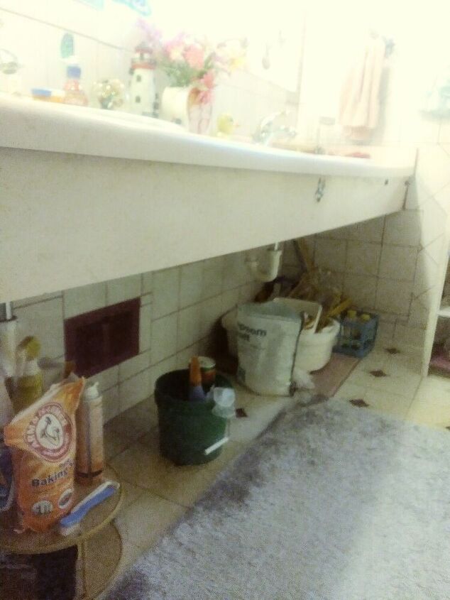 q what can i do under the counter to cover up my bathroom supplies