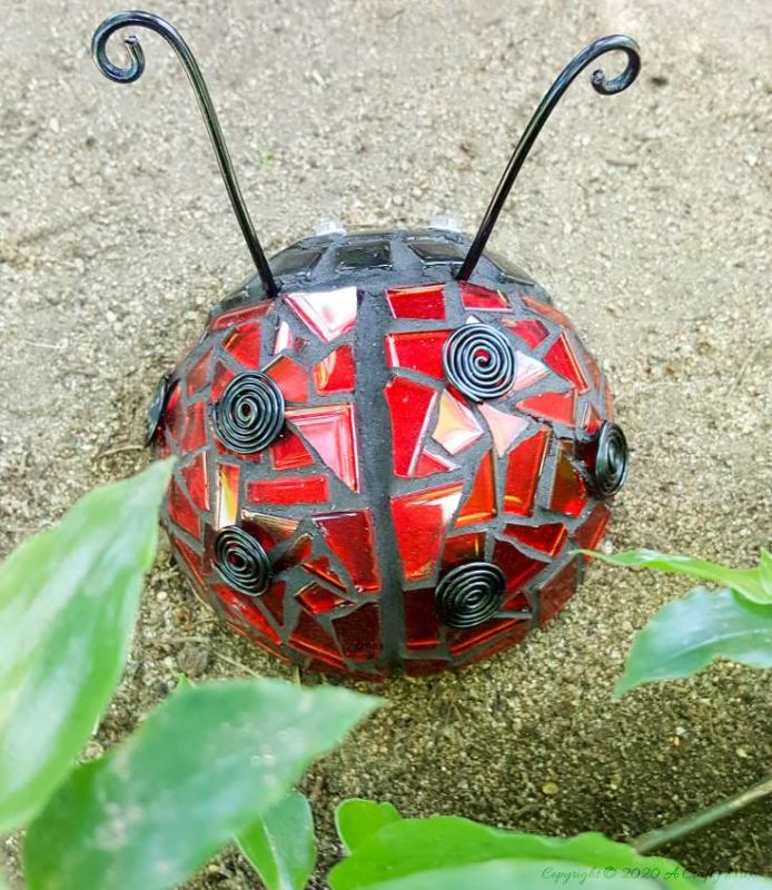 20 whimsical garden ideas that ll make your neighbors stop and stare, An adorable mosaic ladybug