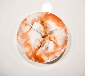 s 18 creative ways to use epoxy resin throughout your home, Hang a stylish marble clock