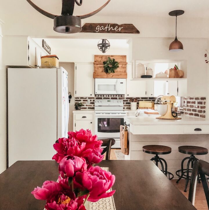 12 stunning ways to fill the space above your stove, Screw in a stylish rustic vent hood cover