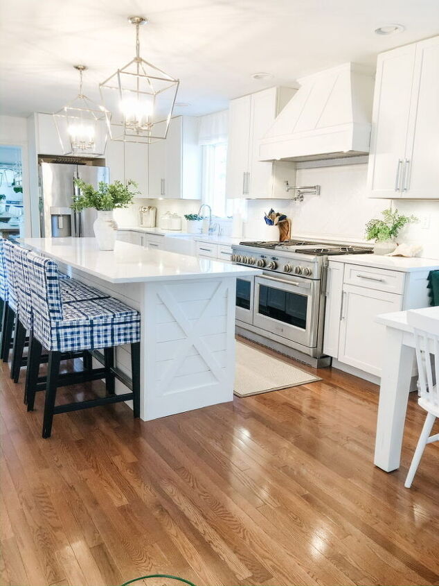 12 stunning ways to fill the space above your stove, Cover an existing range hood with detailed wood