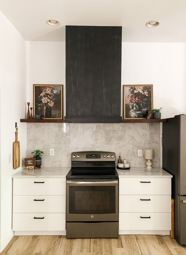 12 stunning ways to fill the space above your stove, Install a sleek black range hood