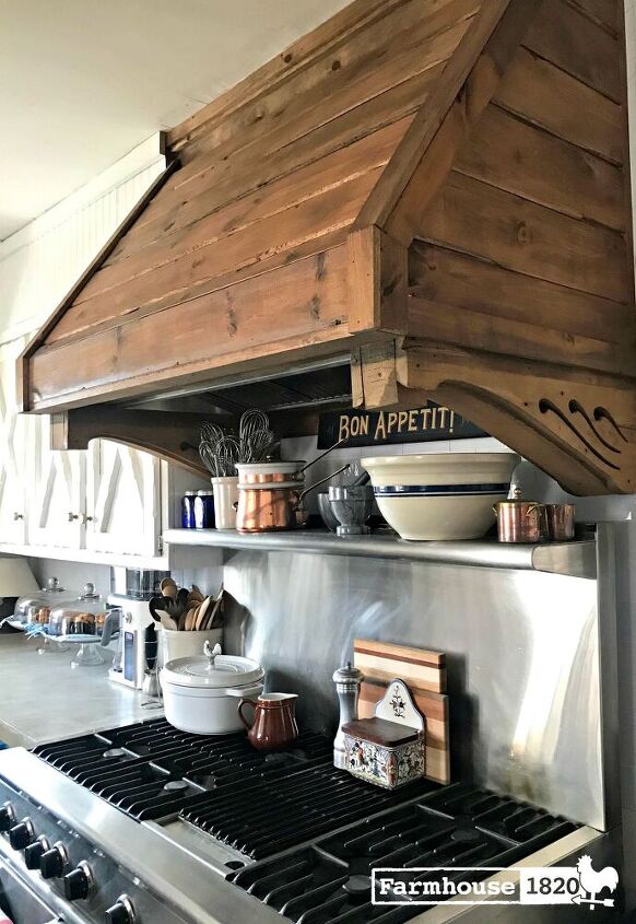 12 stunning ways to fill the space above your stove, Design a stained wooden custom hood