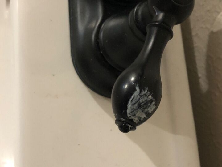 q how to remove paint on black fauce