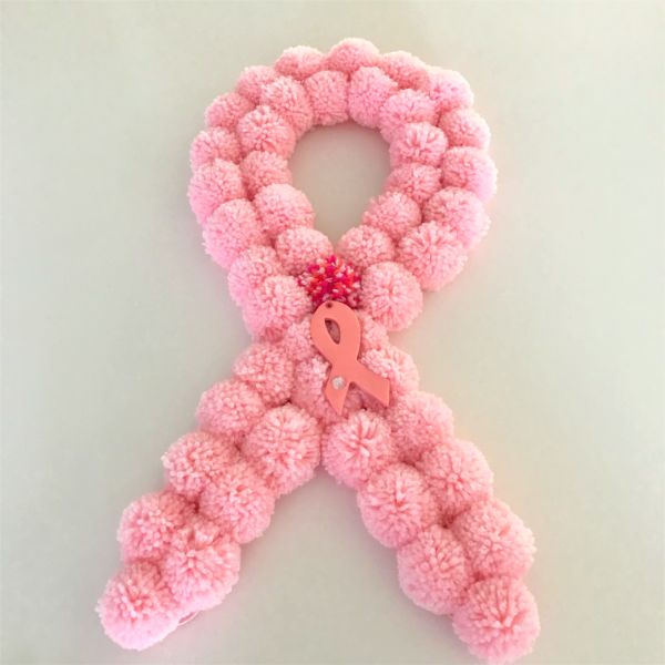 s make your space a cheery haven with 15 pom pom diys, This pink ribbon breast cancer awareness wreath