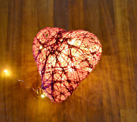 s 14 ways to make your home sparkle with fairy lights, Hang sweet glowing heart shaped decorations