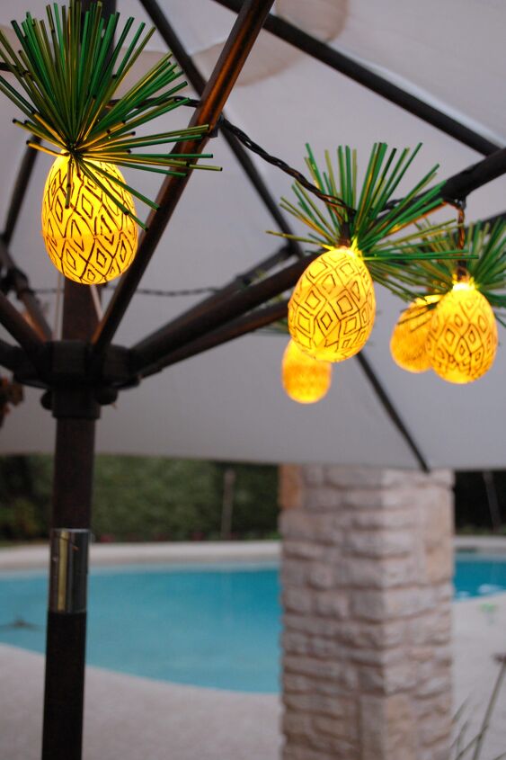 s 14 ways to make your home sparkle with fairy lights, String together pineapple lights from Easter eggs