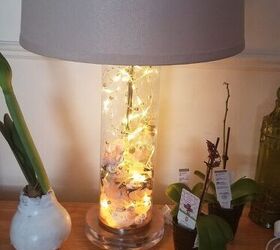 s 14 ways to make your home sparkle with fairy lights, Decorate your lamp base with lights and seashells