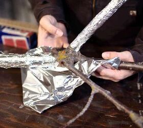 Wrap tin foil around a branch to create incredible outdoor lighting