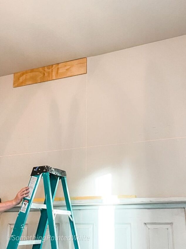 how we used wood flooring to create a fabulous shiplap feature wall in, Using a laser level and starting at the top