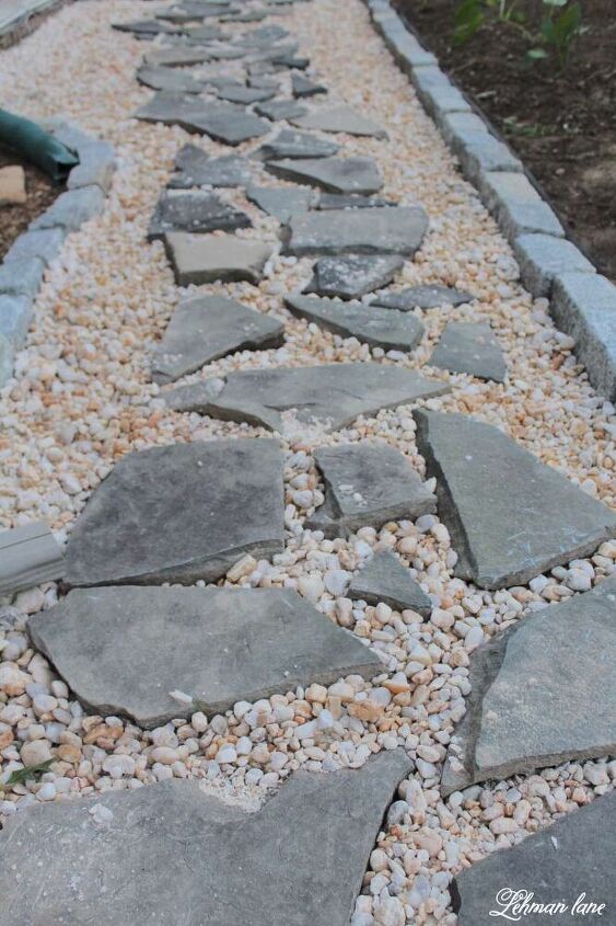 s 13 gorgeous garden paths we re obsessed with this season, Lay stones amongst river pebbles