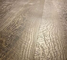 How do I fix vinyl plank flooring that is buckling?