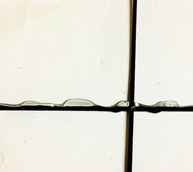 Squeeze hot glue onto a metal trellis to give your wall this charming look