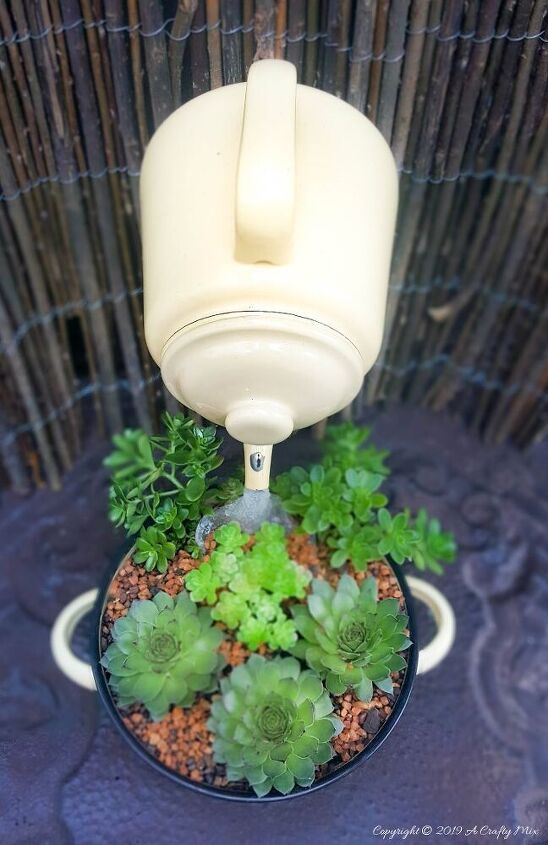 s 20 clever ways to repurpose old kitchenware, Make a floating teapot planter