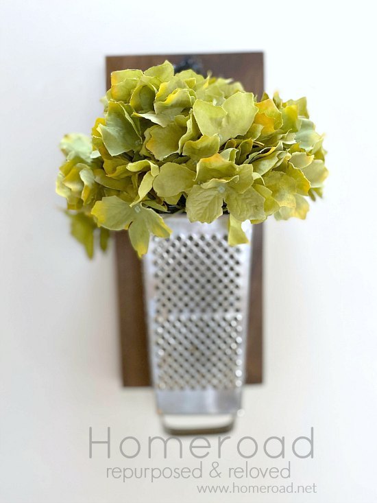 s 20 clever ways to repurpose old kitchenware, Use a grater as a vase