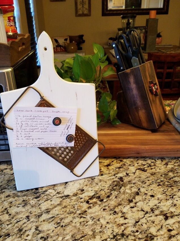 s 20 clever ways to repurpose old kitchenware, Repurpose a grater as a recipe holder