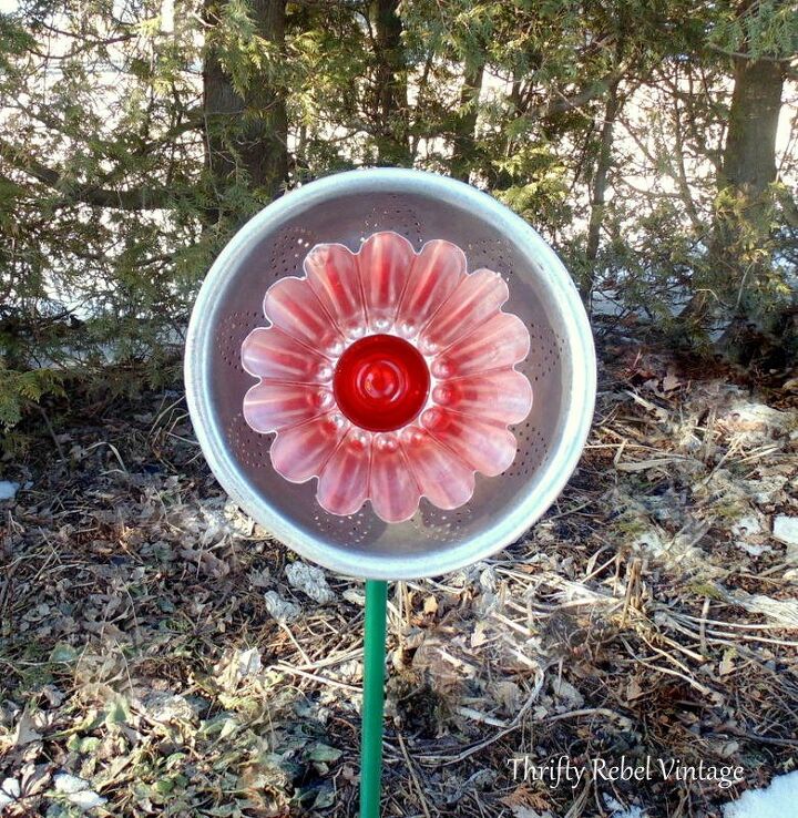 s 20 clever ways to repurpose old kitchenware, Plant a garden flower made from a strainer