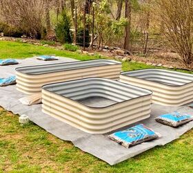 how to start a garden the easy way, I am using 3 8 pea gravel around the beds to finish it off and weigh the fabric down That weight will help smother grass below