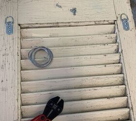 Why she hangs an old shutter by her couch (so copying this!)