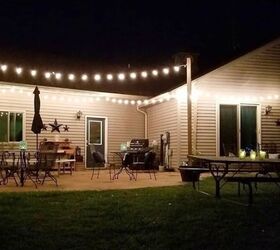 how to make diy string light metal posts, The patio lit up with string lights