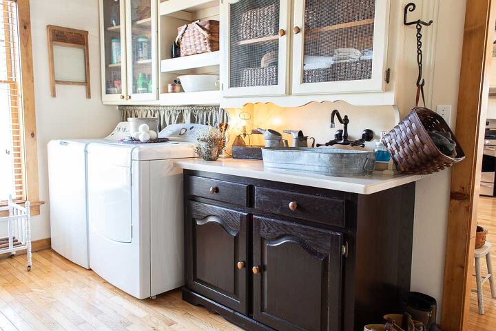 s 15 clever ways you never thought to use your old furniture, Use a china cabinet in your laundry room