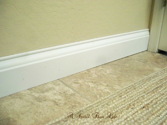 install wide baseboard molding over existing narrow