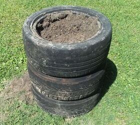 She stacks tires in her front yard and fills them with concrete for the coolest garden accent