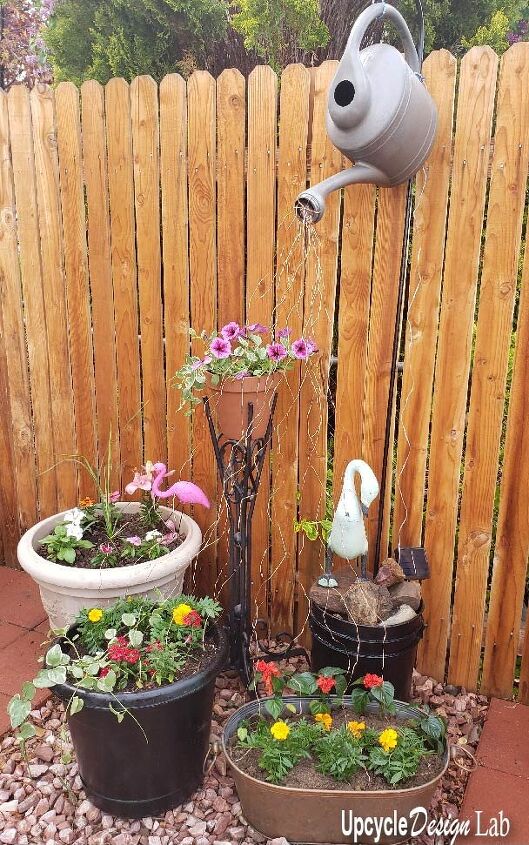 upcycle an old watering can into a solar light display