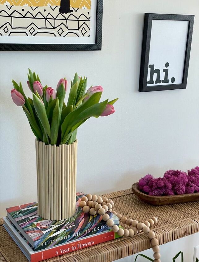 s 16 genius decor hacks that ll save you money, Decorate a vase with dowels