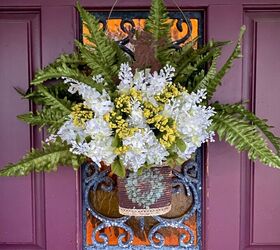 s 12 stunning new ways to show off your flowers this year, Upcycle a rusty can as a floral door hanger
