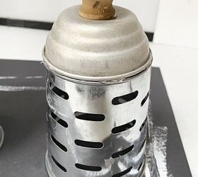 She stacked a measuring cup on top of an olive bucket for this dreamy countertop accent