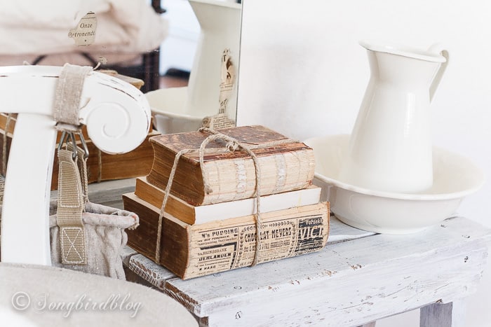 how to decorate with old books, Vintage Decor with Books and Altered Mirror DIY