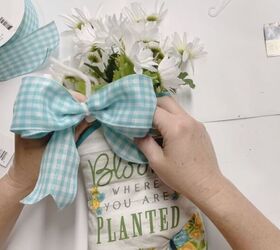 make your oven mitt into a beautiful floral bouquet, Finally attach your bow to the center of your oven mitt using the excess pipe cleaner from before This is where you can attach a tag with a name on it to give it as a gift