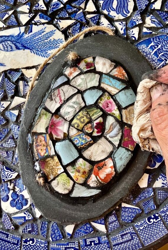 how to create a beautiful garden art piece from your old crockery, Cleaning excess grout off