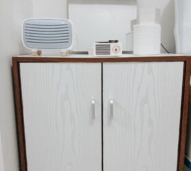 s 13 creative ways to upgrade your boring furniture, Put white accent wallpaper on your cabinet