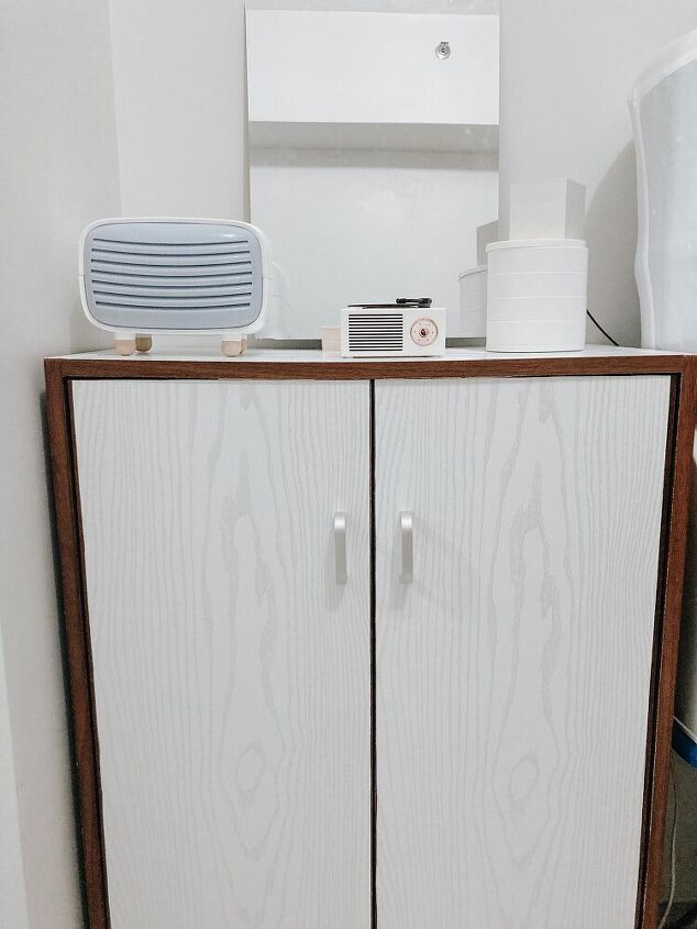 s 13 creative ways to upgrade your boring furniture, Put white accent wallpaper on your cabinet